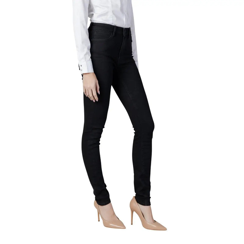 Guess Jean en denim stretch noir en coton pour femme, coupe slim taille haute et près du corps.