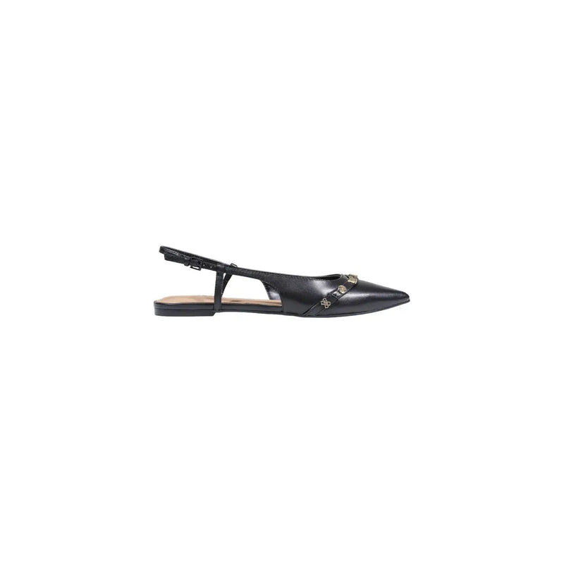 Black leather slingback flat shoe with pointed toe and metallic studs along the vamp by Guess women synthetic