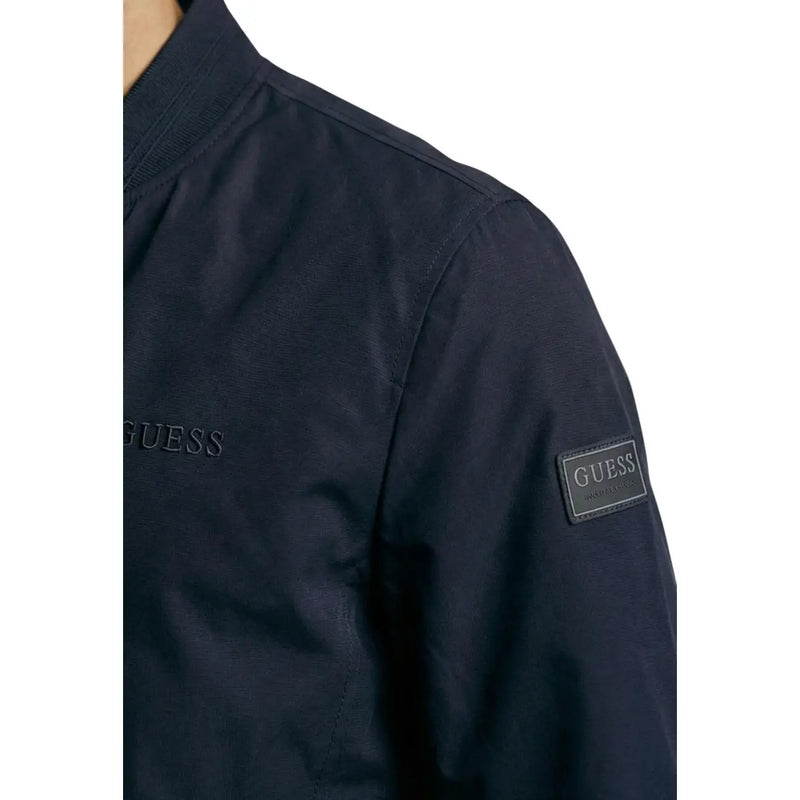 Dark navy blue Guess women polyester bomber jacket with subtle embroidered branding and leather patch on sleeve