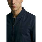 Guess women blue polyester blazer featuring a dark navy blue bomber jacket design with subtle embroidered logo on chest
