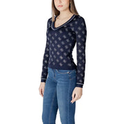 Women’s navy blue long-sleeve V-neck top with white G logo pattern from Guess Spring Summer collection
