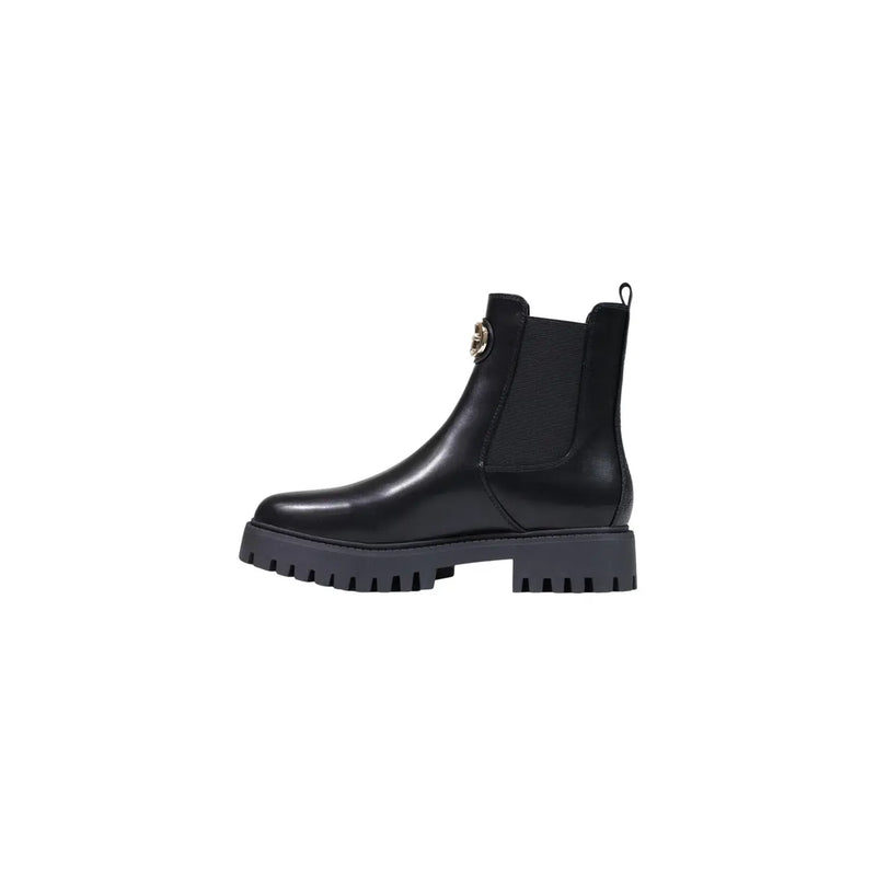 Guess women black polyurethane leather chelsea boot with chunky textured sole and gold-tone logo emblem on the side