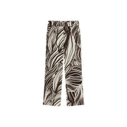 Guess Pantalon large en viscose marron pour femme, noir et crème, orné d'un motif abstrait de feuilles audacieux, issu de la collection printemps-été.