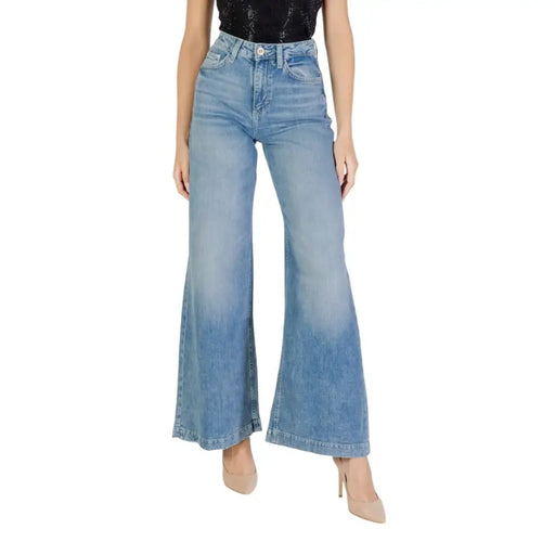 Light wash denim high-waisted flared jeans with zip and button closure for women