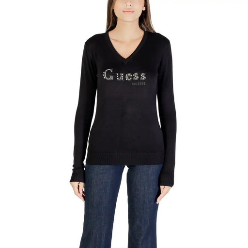Black long-sleeved V-neck T-shirt with Guess est 1981 rhinestone logo on front