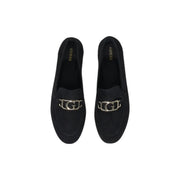 Guess women’s black leather moccasin flats featuring black suede loafers with a silver-toned g logo buckle