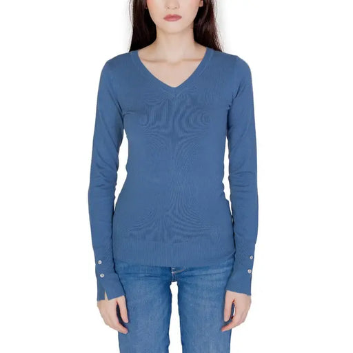 Guess Women Knitwear: Blue long-sleeved V-neck sweater styled with jeans