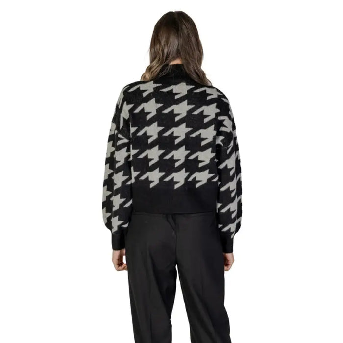Women’s Houndstooth Turtleneck Sweater paired with classic Black Pants