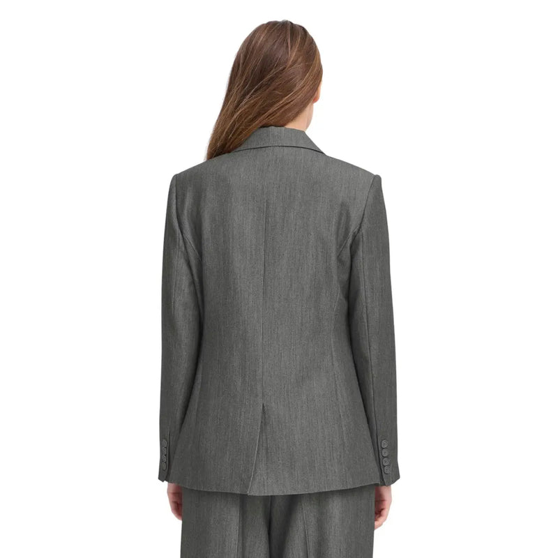A tailored grey polyester blazer for women with a subtle textured weave and structured shoulders by Ichi