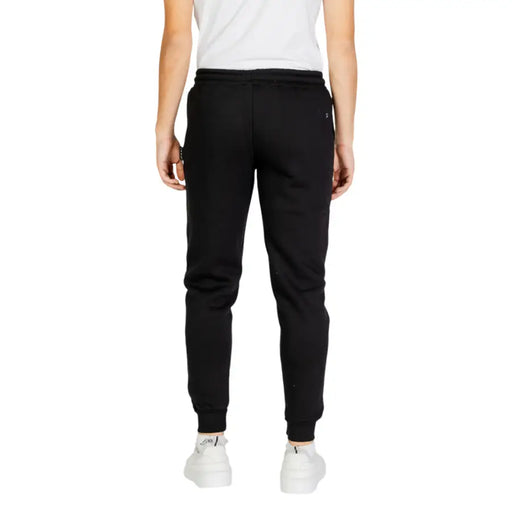 Noir icon Pantalon de jogging pour homme en tissu doux et extensible, avec logo discret de la marque à l'arrière de la ceinture.