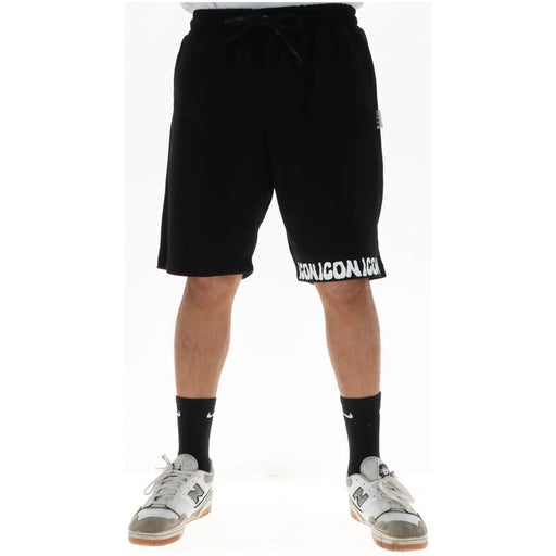 Icon Short noir pour homme avec inscription blanche emblématique le long de l'ourlet et cordon de serrage, vue de face