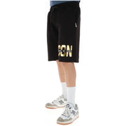 Icon Short de sport noir pour homme avec inscription dorée en gras sur le côté, vue de profil