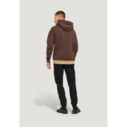 A brown hooded sweatshirt with a relaxed fit and ribbed cuffs paired with Jack & Jones black cotton blend trousers