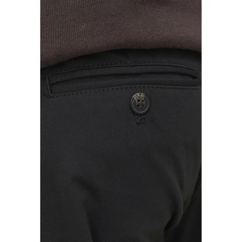 Black polyester men’s fall winter trousers with a single button on the back pocket