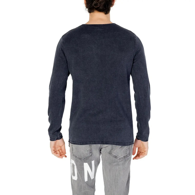 Back view of a dark gray jack & jones blue cotton knit pullover for men with white lettering on the lower back