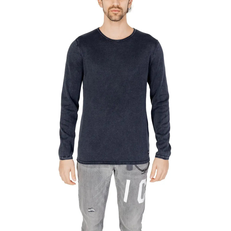 Dark navy long-sleeved cotton knit pullover with subtle texture and brand tag at hem by Jack and Jones for men