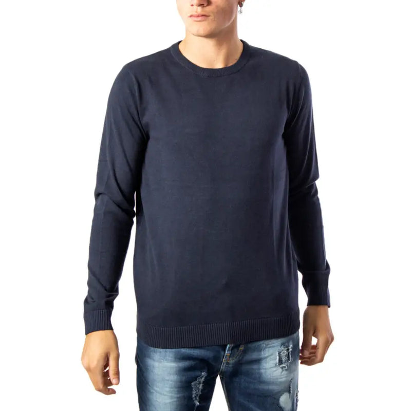 Navy blue crew neck sweater with ribbed cuffs and hem, possibly from a casual wear brand.