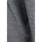 Charcoal gray ribbed sweater with black trim and pocket detail.