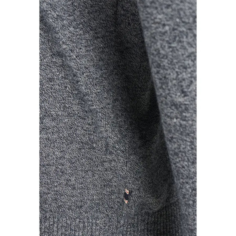 Charcoal gray ribbed sweater with black trim and pocket detail.