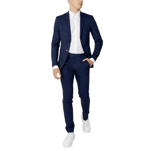 Navy blue tailored Jack and Jones spring summer suit with matching trousers and white dress shirt for men