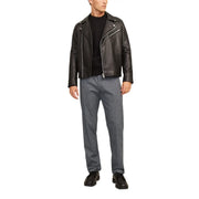 Black leather biker jacket with silver zippers and snap buttons paired with jack & jones grey cotton stretch trousers for men fall winter