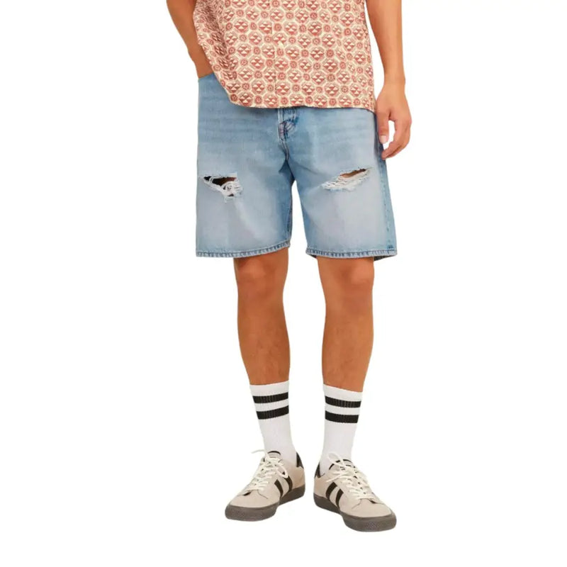 Light blue denim shorts with distressed details and white stripes on the socks.