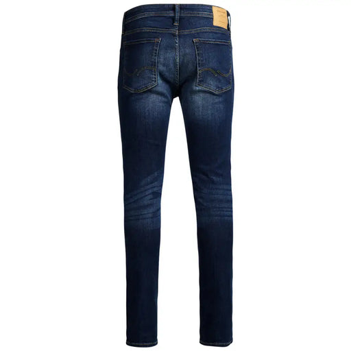 Jean slim stretch bleu uni pour homme Jack & Jones, avec un délavage subtil aux cuisses, de couleur bleu foncé.