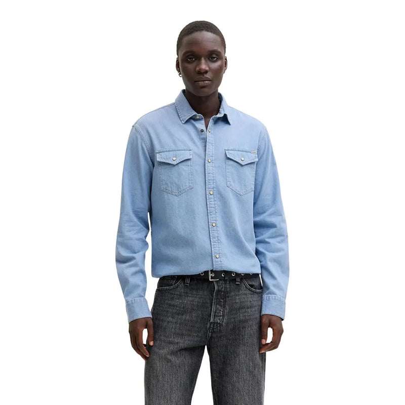 Light blue denim button-up shirt by Jack Jones with two chest pockets and silver-toned buttons for men