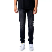 Jean slim noir pour homme Jack & Jones, en denim délavé et légèrement usé, idéal pour l'automne-hiver.