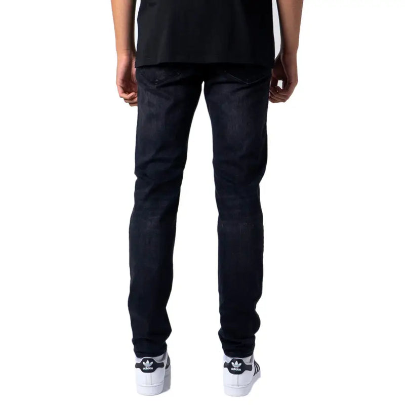 Jean noir en denim foncé pour homme Jack and Jones, coupe slim, délavage subtil et coutures classiques, idéal pour l'automne-hiver.