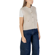 Beige ribbed knit sleeveless vest with button front and two front pockets