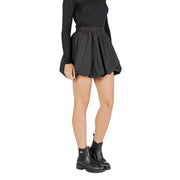 Jacqueline de yong black polka dot flared mini skirt paired with ribbed knit top and black leather chelsea boots