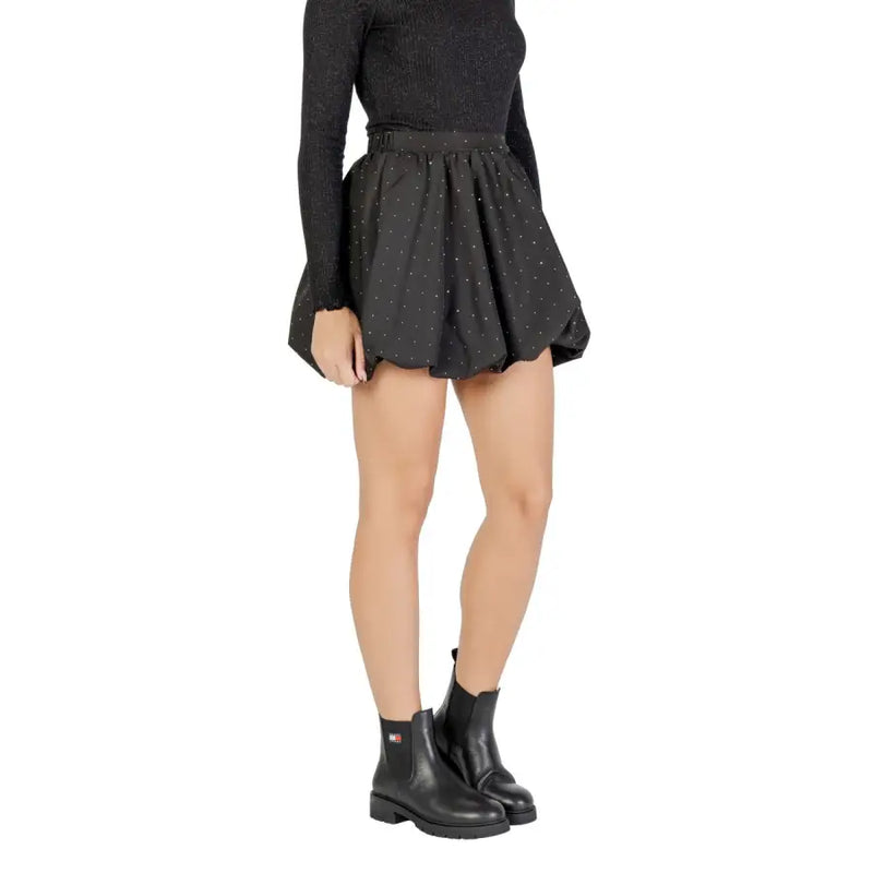 Jacqueline de yong black polka dot flared mini skirt paired with ribbed knit top and black leather chelsea boots