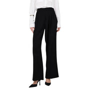 Pantalon noir taille haute à jambes larges de Jacqueline de Yong, avec fermeture éclair sur le devant et poches, coupe ajustée.