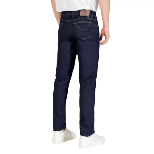 Dark blue slim fit jeans with a classic five-pocket design and belt loops, made of denim material.