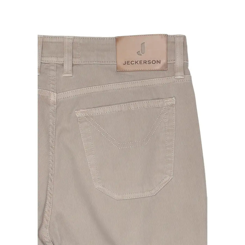 velours côtelé beige jeckerson Pantalon homme en piqué de coton mélangé avec écusson de marque en cuir beige à la taille.
