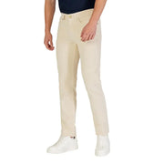 Beige slim-fit chino pants with button fly and pockets, likely made of cotton or polyester blend.