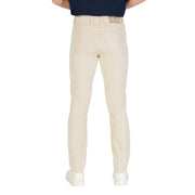 Beige golf pants with a slim fit and elastic waistband, likely made of cotton or polyester blend.