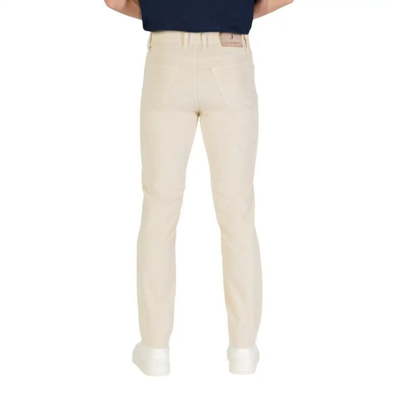 Beige golf pants with a slim fit and elastic waistband, likely made of cotton or polyester blend.