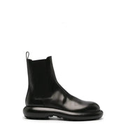 Bottines Chelsea pour homme en cuir noir Jil Sander, avec semelle épaisse brillante et empiècements élastiques sur les côtés, collection automne-hiver
