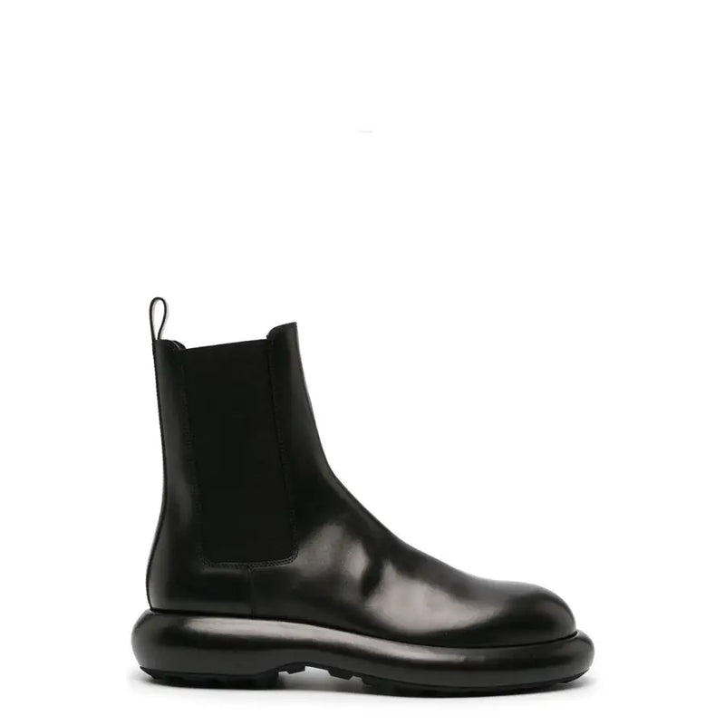 Bottines Chelsea pour homme en cuir noir Jil Sander, avec semelle épaisse brillante et empiècements élastiques sur les côtés, collection automne-hiver
