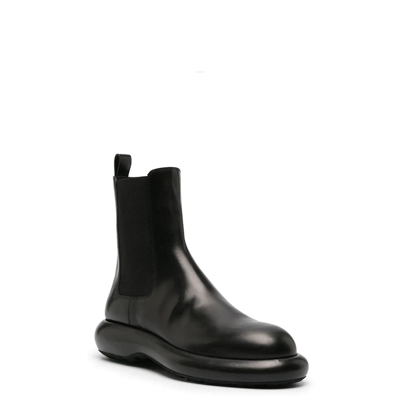 Jil Sander men black leather ankle boot with chunky sole and elastic side panels from fall winter collection