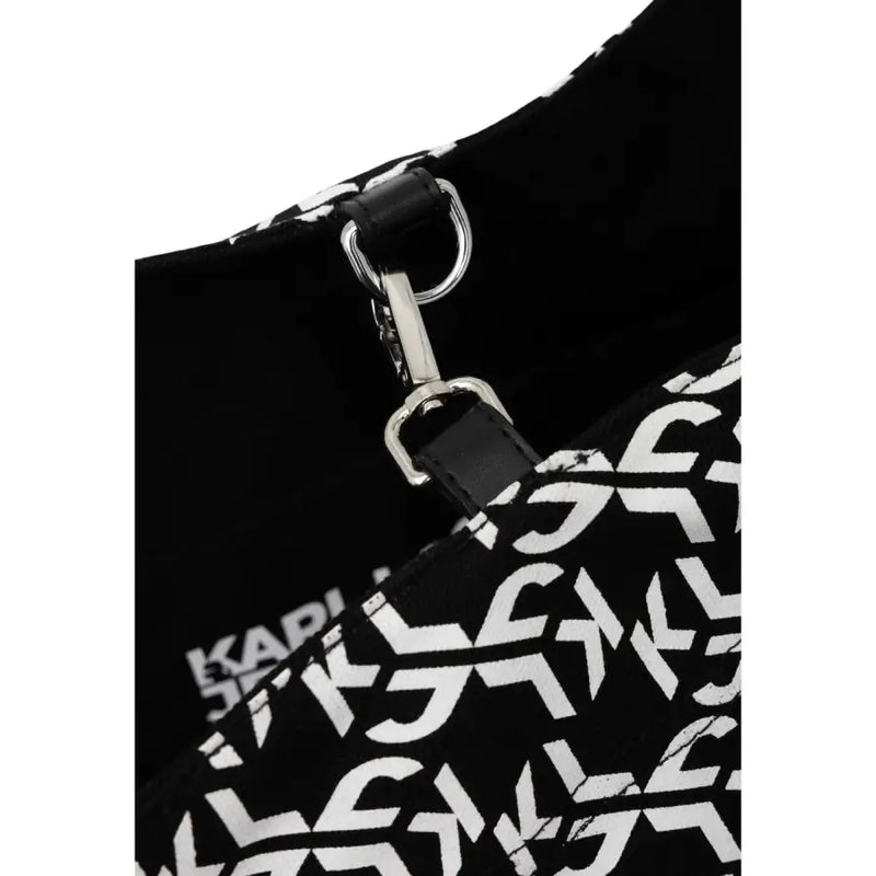 Black karl lagerfeld shoulder bag with bold white graffiti print and silver metal clasp in 36x68x15 size