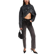 Young woman wearing Karl Lagerfeld black cotton blazer and jeans for fall winter season