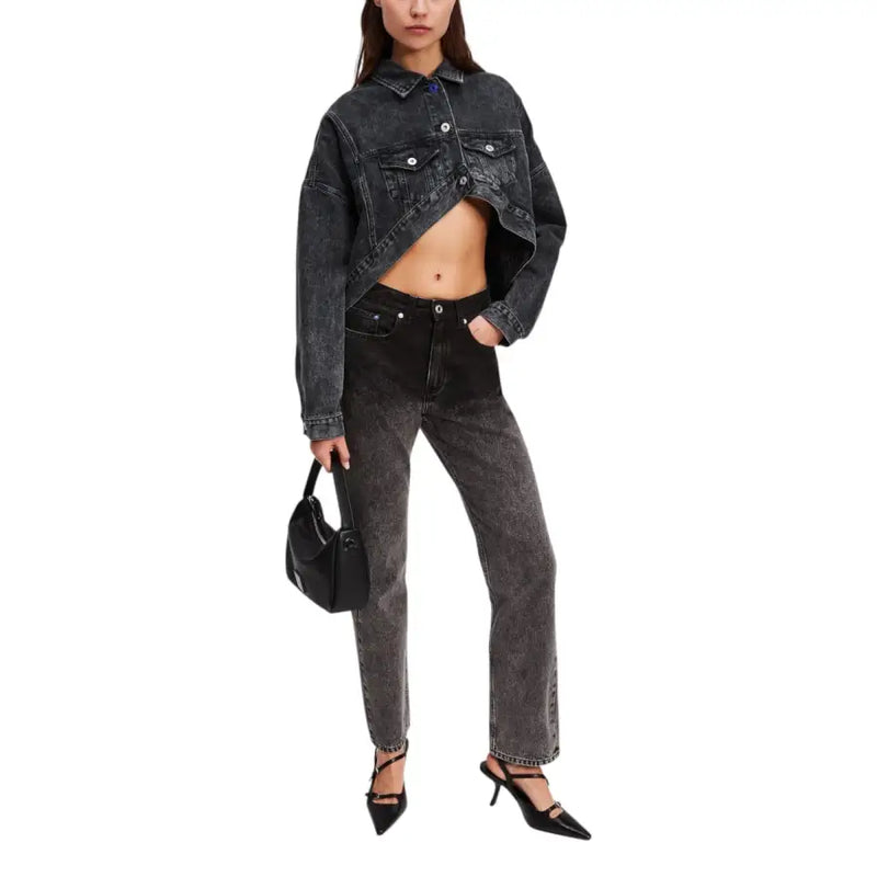 Young woman wearing Karl Lagerfeld black cotton blazer and jeans for fall winter season
