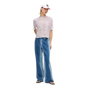 A light pink Karl Lagerfeld Jeans women t shirt with short sleeves sheer floral mesh fabric and round neck