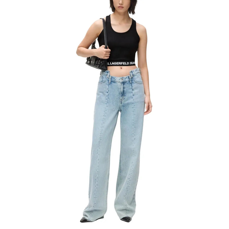 Jean taille haute à jambes larges en denim clair délavé, avec une coupe classique à cinq poches et des coutures apparentes. Karl Lagerfeld