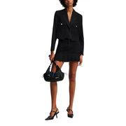 Black leather shoulder bag with blue accents and silver hardware paired with Karl Lagerfeld Jeans womens long black blazer for fall winter