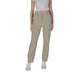 Khaki cargo pants with elastic cuffs styled with white sneakers from B.young
