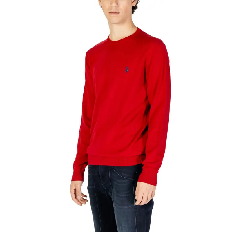 A vibrant red long-sleeved knitted sweater with a crewneck and small embroidered logo on the left chest